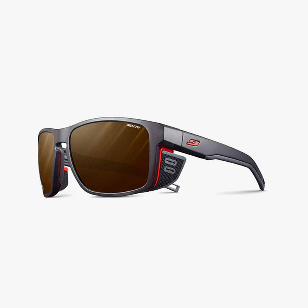 Julbo Shield M mit Sehstärke / Schwarz - Orange / REACTIV 2-4 Polarized